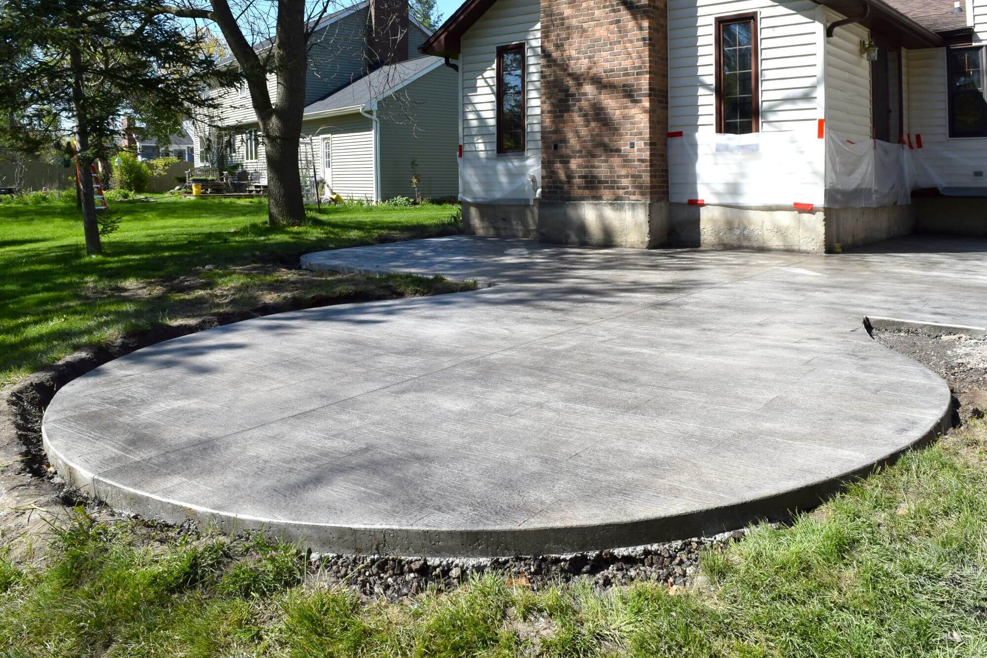 Edina Concrete Company Freshly poured concrete patio in Edina, MN by Twin Cities Concrete